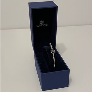 Swarovski Rhodium Plate Round Silver-Tone Bangle with 3 crystals.